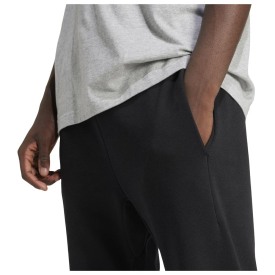 Adidas Ανδρικό παντελόνι φόρμας Essentials Linear Fleece Cuffed Pants Adidas Ανδρικό παντελόνι φόρμας Essentials Linear Fleece Cuffed Pants